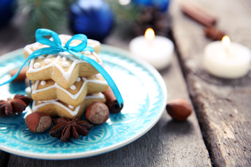 Cookies with spices and Christmas decor, on wooden table