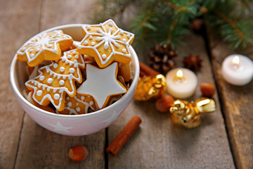 Cookies with spices and Christmas decor, on wooden table