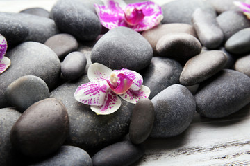 Fototapeta na wymiar Spa stones and orchids closeup
