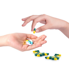 Drug capsules and pills in hand