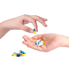 Drug capsules and pills in hand