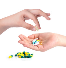 Drug capsules and pills in hand