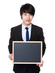 Young Businessman show with the blank chalkboard