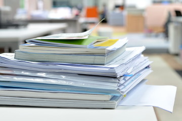 Documents on desk/documents on desk at business office.