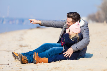 happy young family have fun on beach