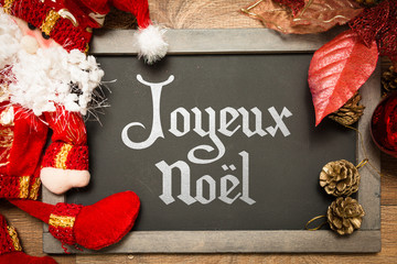 Blackboard with the text: Happy Christmas (in French) in a conceptual image