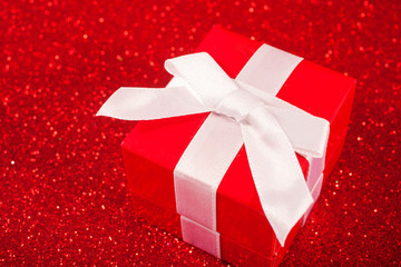 Red gift boxes on glitter red background