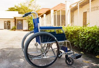 Wheelchair in front of the disabled toilet. Color filters.