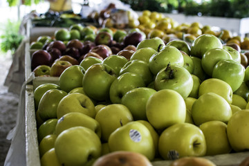 Assorted apples on display at farmers' market