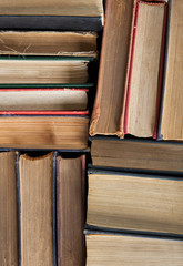 Old and used hardback books or text books seen from above. Books