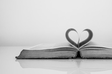 Vintage tone of Pages of a book forming the shape of the heart.