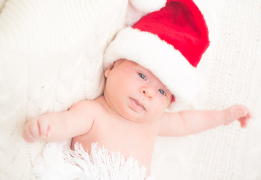 Infant boy in Santa hat