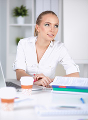 Attractive businesswoman sitting  in the office