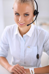 Naklejka premium Close-up portrait of a customer service agent sitting at office