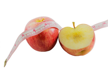 Red apple with measuring tape, diet concept.