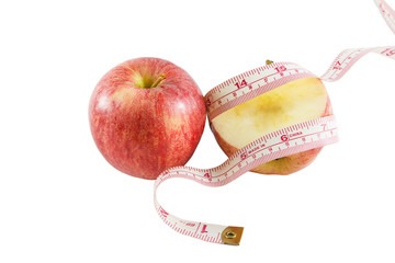Red apple with measuring tape, diet concept.