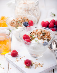 Healthy breakfast. Granola with pumpkin seeds, honey, yogurt, fresh berries .