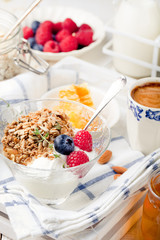 Healthy breakfast. Granola with pumpkin seeds, honey, yogurt, fresh berries .