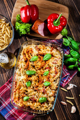 Casserole fusilli pasta with sausage, zucchini and cheese