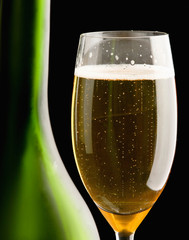 Wine glass and Bottle, isolated on black background