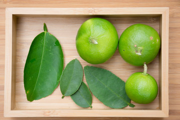 Top view of Lemons on wooden box