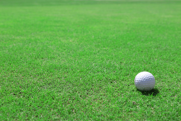 Golf ball on green golf course