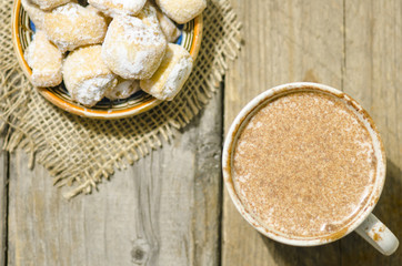 Hot chocolate and crescent rolls stuffed with walnut and powder