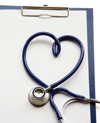 Medical clipboard and stethoscope isolated on white background