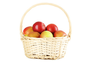 Fresh apples in basket isolated on a white