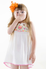 the young girl on the white dress  posing and pointing hand for the camera showing funny faces isolated on the white background