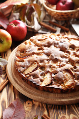 Homemade apple cake on brown wooden table