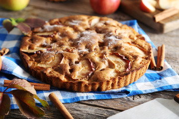 Homemade apple cake on grey wooden table