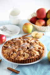 Homemade apple cake on blue wooden table