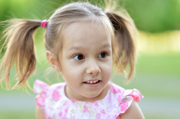 little girl on  in summer day