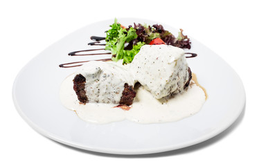 Steak with white mushroom sauce.