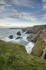 Stunning landcape image of Bedruthan Steps on Cornwall coast in