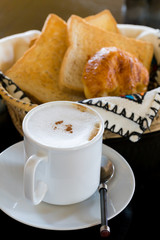 Hot Coffee with Bread in background
