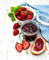 Strawberry jam and fresh strawberries