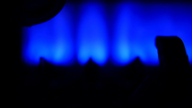 Blue flames of a gas inside of a boiler