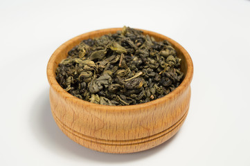 Green tea in a wooden bowl