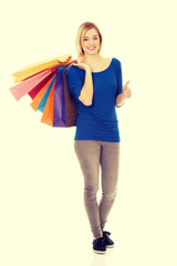 Woman with a lot of shopping bags.