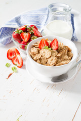 Breakfast - cereal and berries in white bowl
