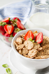 Breakfast - cereal and berries in white bowl