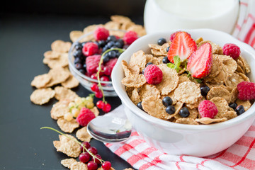 Breakfast - cereal and berries in white bowl