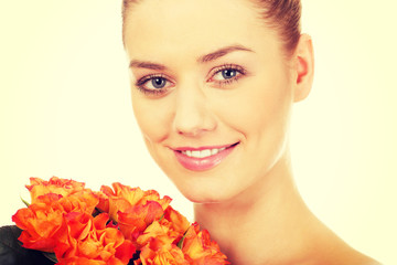 Fototapeta premium Smiling woman with fresh roses.