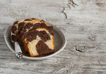 pieces of chocolate cake on the oval dish on  wooden background