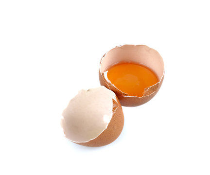 Eggshell and yolk on a white background