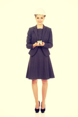 Architect woman holding model house.