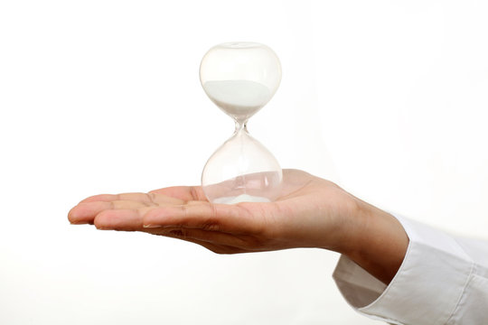 Business woman holding hourglass