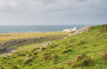 Fototapeta na wymiar Lighthouse at West coast of Scotland